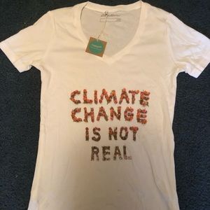 “climate change is not real” white T-shirt.